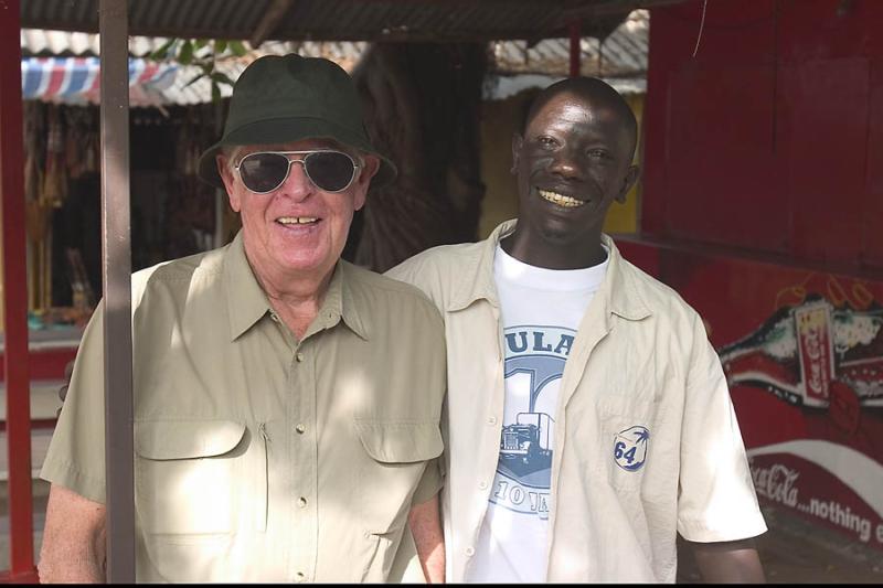 CRW_4424 Oct. 24, 2006 - Banjul, Gambia.  Jim Wilkie with our guide, 
