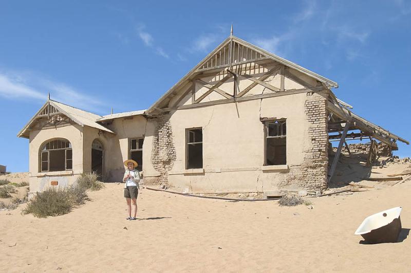 CRW_4770 Nov. 11, 2006 - Kolmanskop Ghost Town, Namibia.  Adele checking out some real estate.