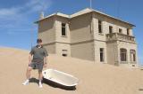 CRW_4750 Nov. 11, 2006 - Kolmanskop Ghost Town, Namibia.  George Reavey checking out the plumbing fixtures.